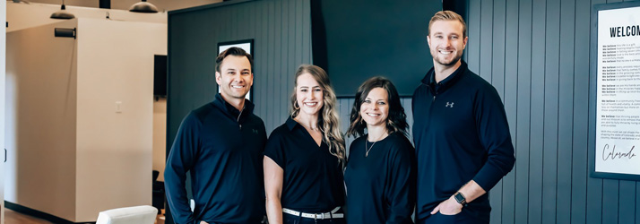 Chiropractor Colorado Springs CO Joshua And Taylor Logan With Team